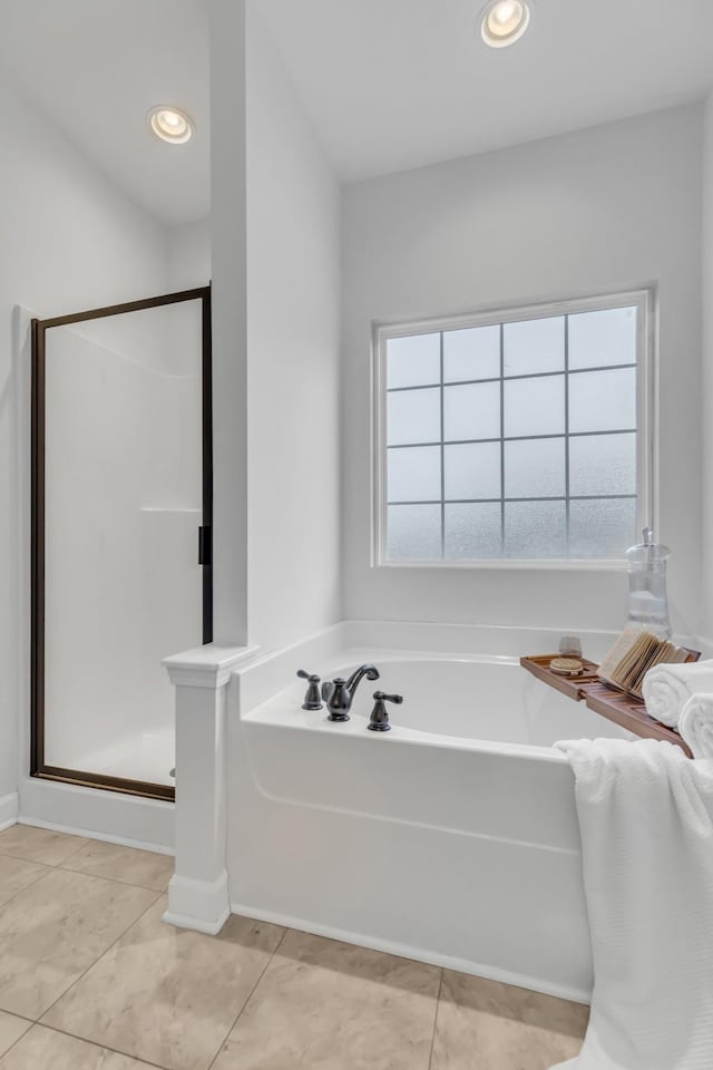 full bathroom featuring recessed lighting, tile patterned flooring, a shower stall, and a bath