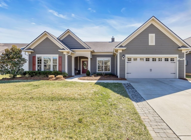 view of front of house with a garage, a front yard, driveway, and a chimney