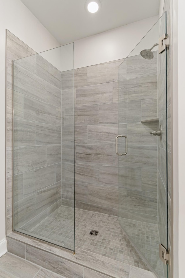 full bathroom featuring a stall shower