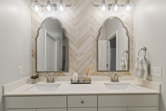 full bath with double vanity, decorative backsplash, and a sink