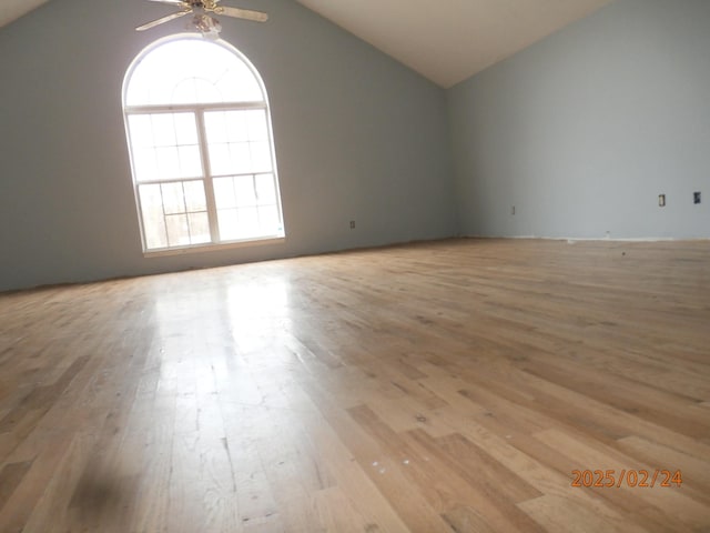 unfurnished room featuring vaulted ceiling, ceiling fan, and light wood finished floors