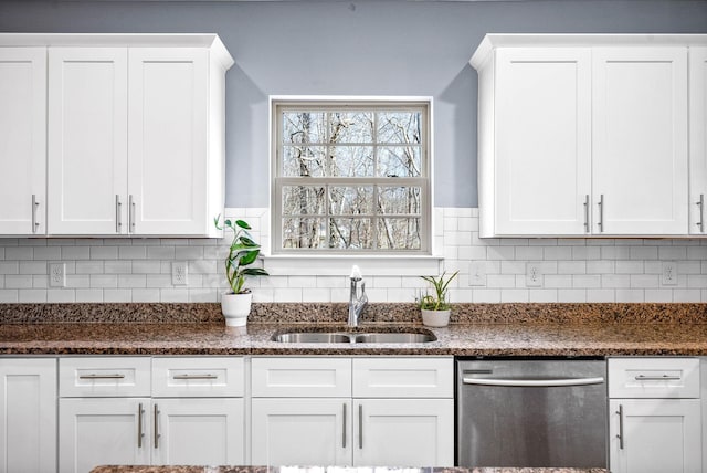 kitchen featuring a sink, tasteful backsplash, white cabinets, and dishwasher