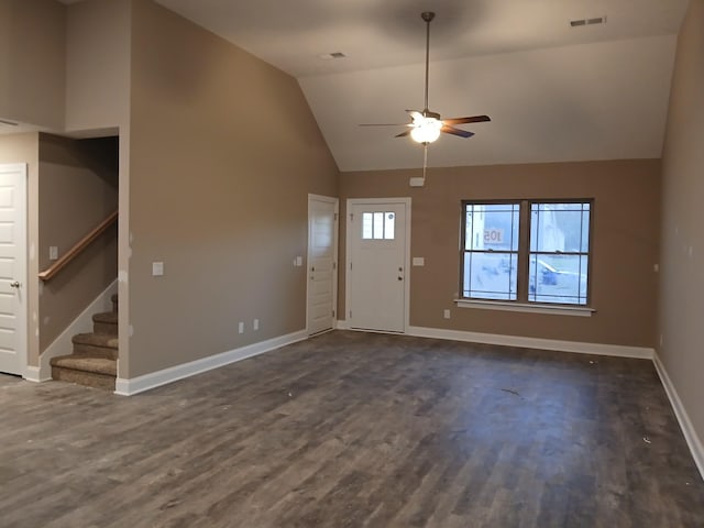 entryway with vaulted ceiling, dark wood-type flooring, stairs, and visible vents