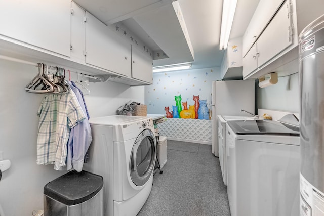 washroom featuring carpet, washer and clothes dryer, cabinet space, baseboards, and wallpapered walls