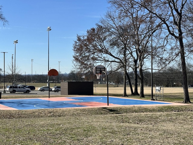 view of sport court with a yard and community basketball court