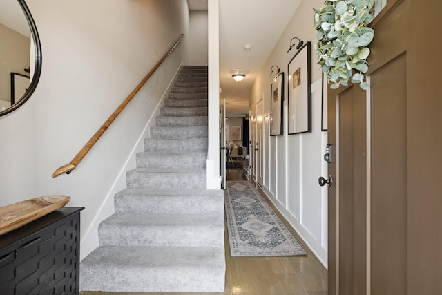 stairs with wood finished floors