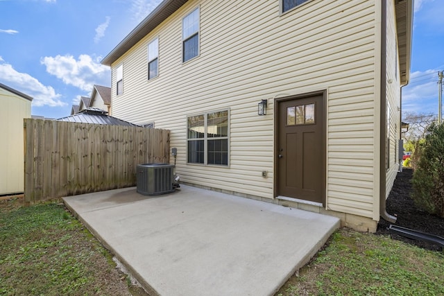 back of property featuring cooling unit, a patio, and fence