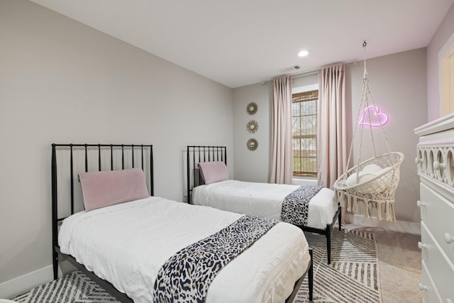 carpeted bedroom featuring recessed lighting, visible vents, and baseboards