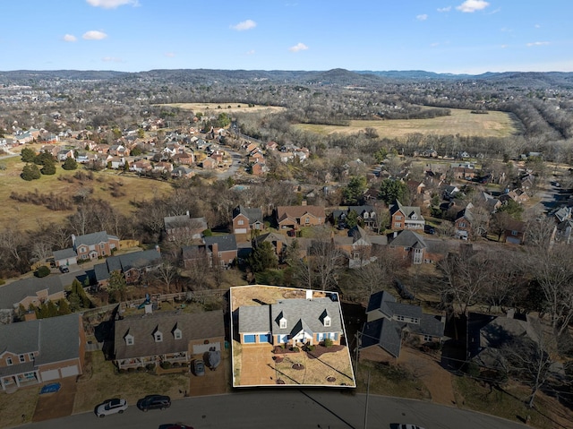 birds eye view of property featuring a mountain view and a residential view