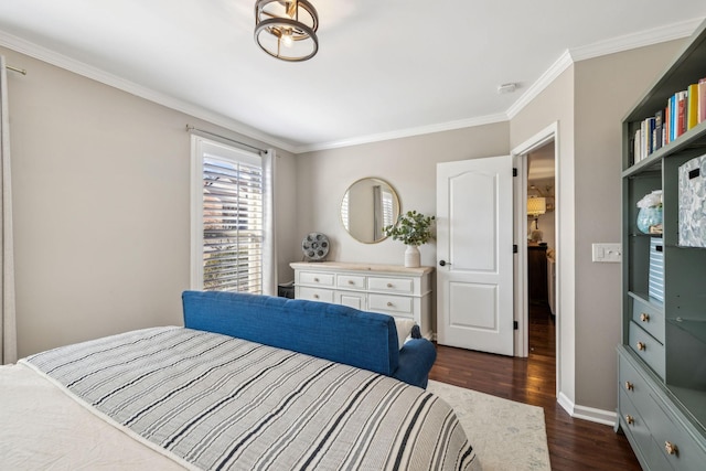 bedroom featuring crown molding, dark wood finished floors, and baseboards