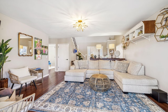 living area featuring baseboards and wood finished floors