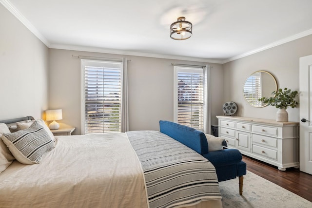 bedroom featuring dark wood finished floors and crown molding