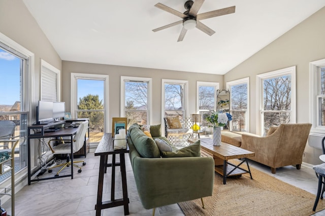 sunroom / solarium featuring lofted ceiling, ceiling fan, and plenty of natural light