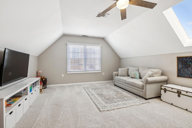 living room featuring baseboards, vaulted ceiling with skylight, visible vents, and light colored carpet