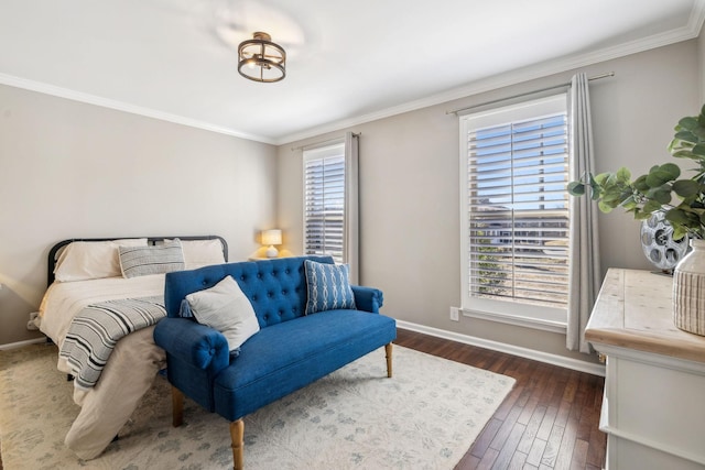 bedroom featuring dark wood-style floors, baseboards, and crown molding