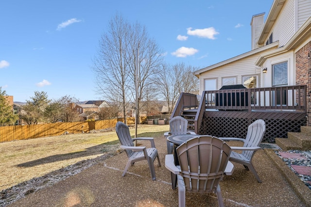 view of yard with a fenced backyard and a wooden deck