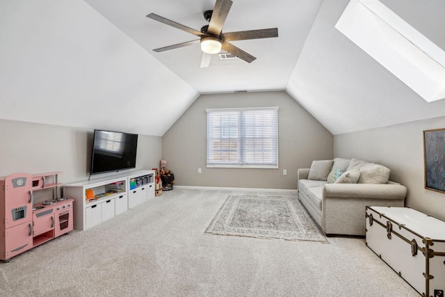 interior space with light colored carpet, visible vents, vaulted ceiling, ceiling fan, and baseboards