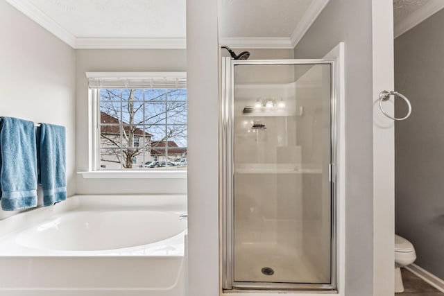 bathroom with a garden tub, ornamental molding, a shower stall, and toilet