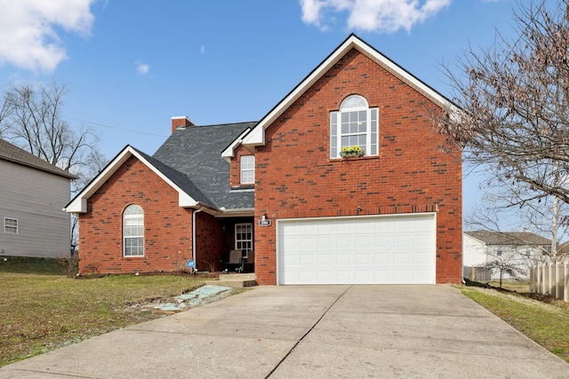 traditional-style house with an attached garage, a chimney, concrete driveway, and brick siding