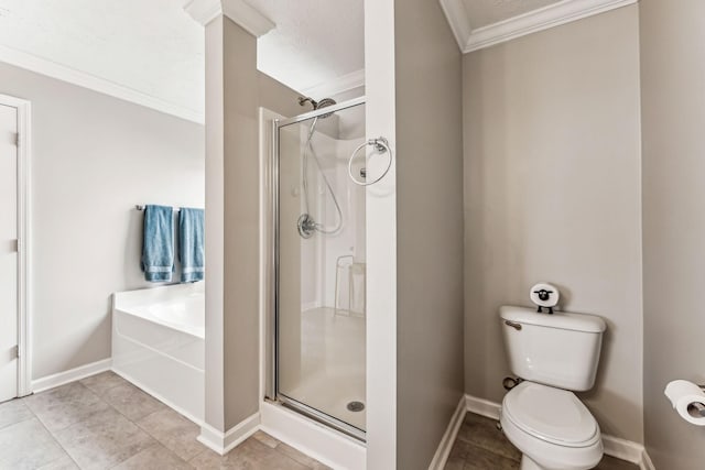 bathroom with a stall shower, baseboards, toilet, crown molding, and a bath