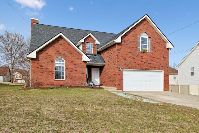 traditional-style house featuring concrete driveway, brick siding, an attached garage, and a front yard