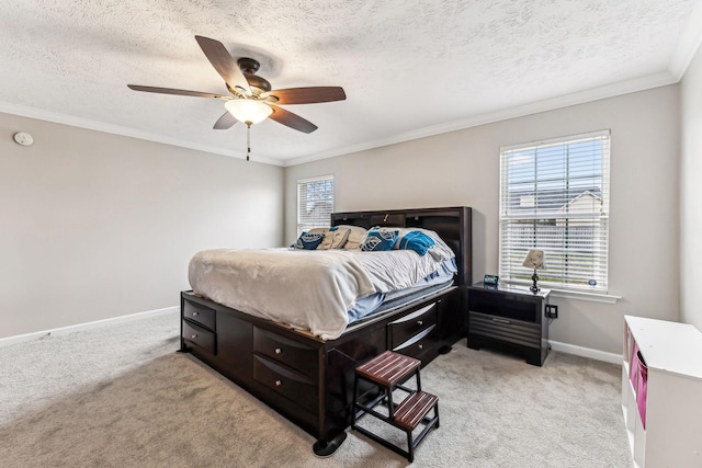 bedroom featuring light carpet, ornamental molding, a textured ceiling, and baseboards