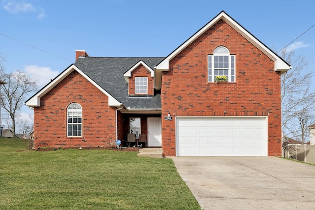 traditional-style house featuring driveway, a garage, a front lawn, and brick siding