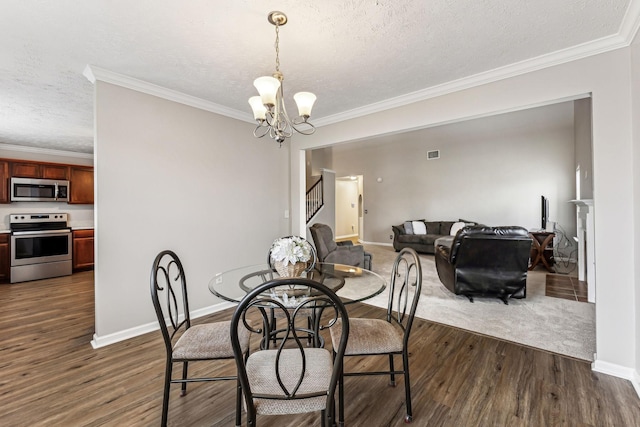 dining room with crown molding, dark wood-type flooring, stairway, and a notable chandelier