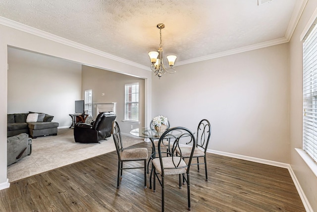 dining space featuring dark wood-style floors, baseboards, and a notable chandelier