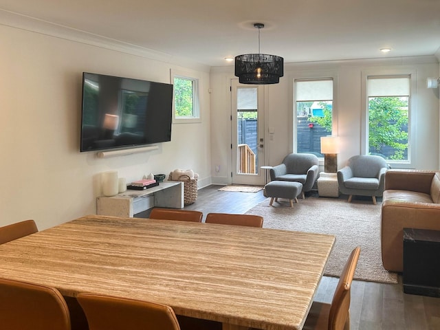 living room with ornamental molding and dark wood finished floors