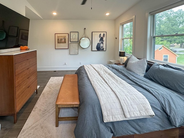 bedroom with baseboards, dark wood-style flooring, and recessed lighting