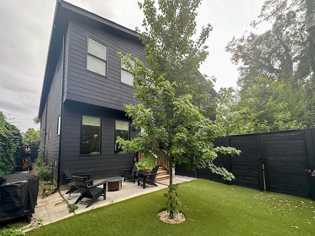 view of yard featuring fence and a patio