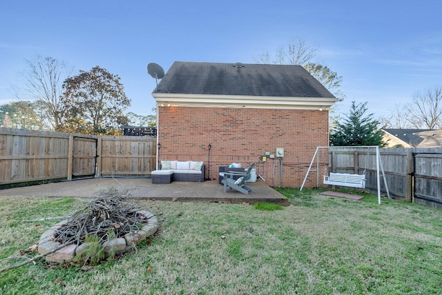 view of yard featuring a fire pit, a patio, and a fenced backyard