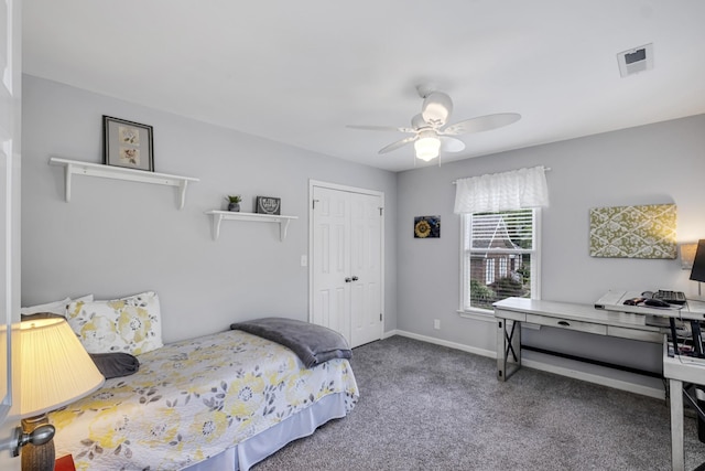 bedroom with a closet, visible vents, a ceiling fan, carpet flooring, and baseboards