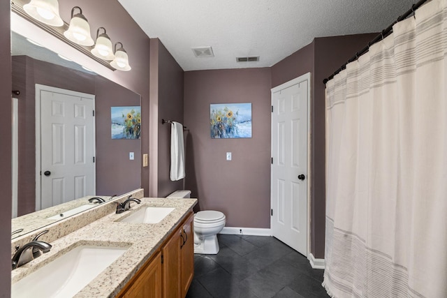 full bathroom with visible vents and a sink