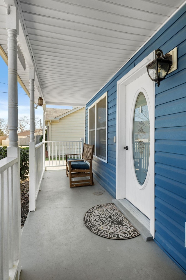 view of exterior entry featuring a porch