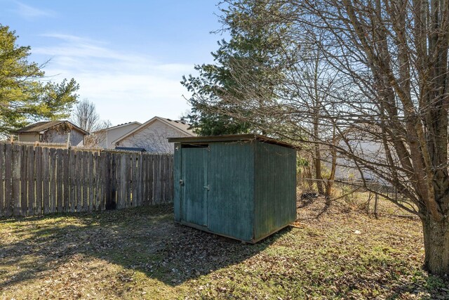 view of shed with a fenced backyard