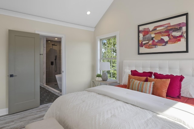 bedroom with ensuite bath, vaulted ceiling, wood finished floors, and recessed lighting