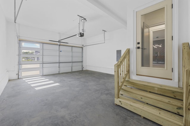 garage with electric panel and a garage door opener