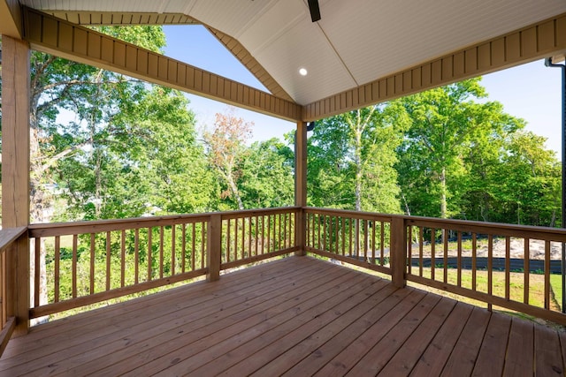 wooden deck with a ceiling fan