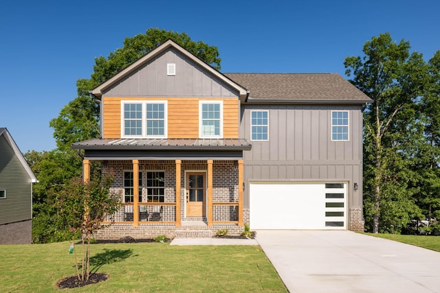 view of front of property with a porch, a garage, brick siding, driveway, and a front lawn