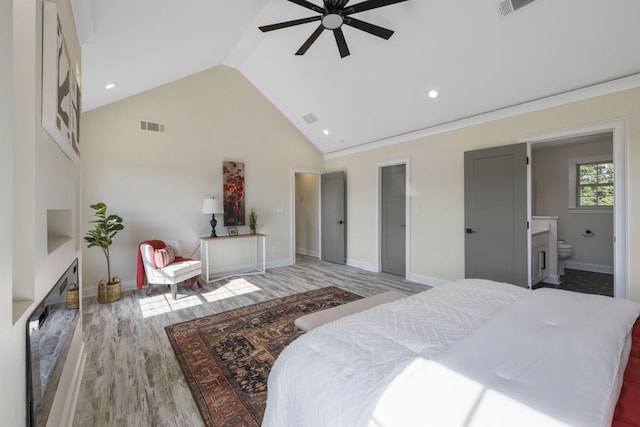 bedroom with high vaulted ceiling, visible vents, light wood-style flooring, and baseboards