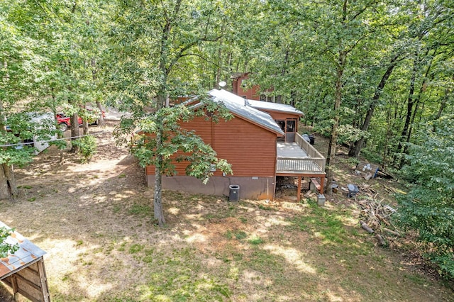 view of side of home featuring a wooden deck