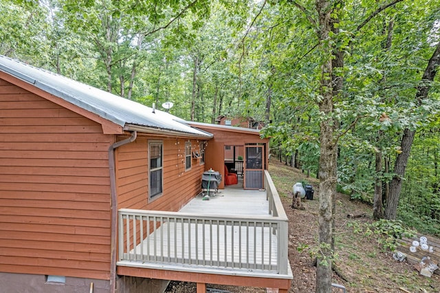 wooden terrace featuring area for grilling