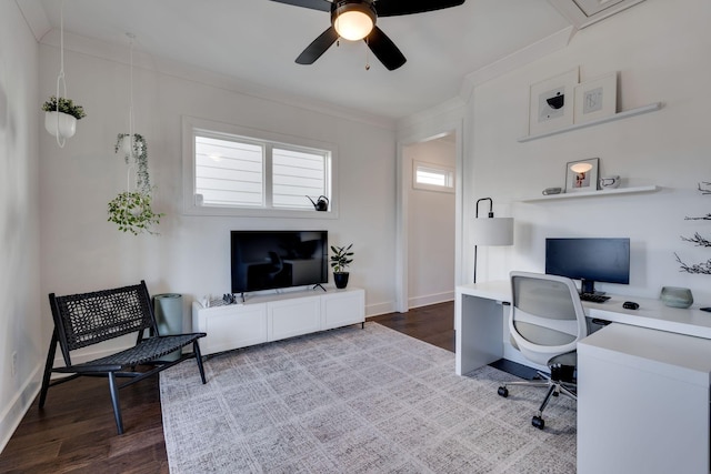 office space with baseboards, wood finished floors, a ceiling fan, and crown molding