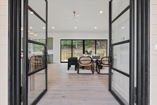 interior space featuring recessed lighting, plenty of natural light, and light wood-style flooring