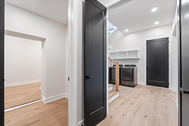 hallway featuring light wood-type flooring, stairway, baseboards, and recessed lighting