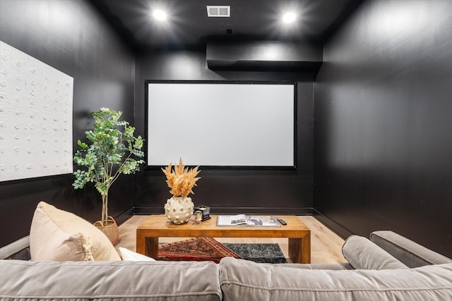 home theater room featuring recessed lighting, visible vents, and wood finished floors