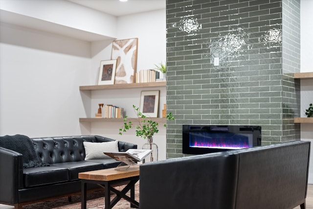 living room featuring a large fireplace