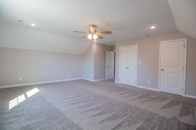 additional living space with recessed lighting, a ceiling fan, carpet flooring, vaulted ceiling, and baseboards